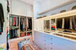 Step into luxury with this stunning walk-in closet, designed to elevate your storage and organization.