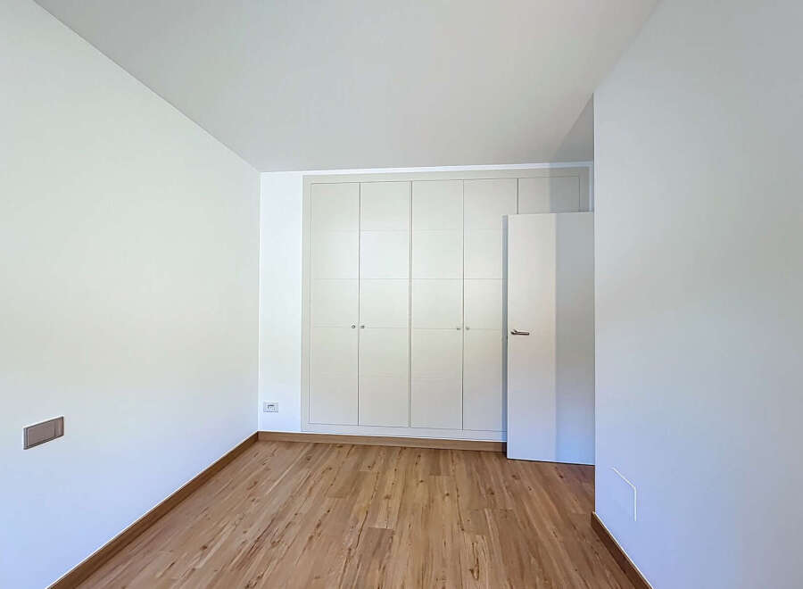 Discover the elegance of this modern space, featuring a built-in closet for ample storage.