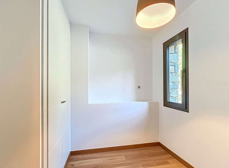This bright and airy room features a modern design with clean lines and a neutral color palette.
