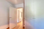Step into this beautifully designed property featuring a bright and airy hallway with hardwood floors.
