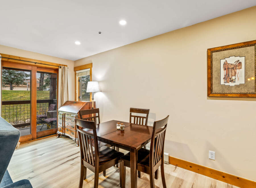 This charming dining area features a warm, inviting atmosphere, perfect for enjoying meals with loved ones.