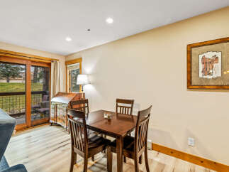 This charming dining area features a warm, inviting atmosphere, perfect for enjoying meals with loved ones.
