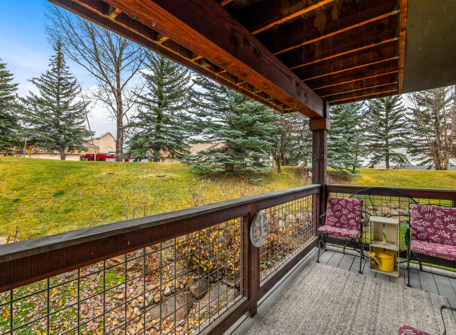Enjoy the serene views from this charming porch, perfect for relaxing and taking in the natural beauty.