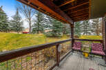 Enjoy the serene views from this charming porch, perfect for relaxing and taking in the natural beauty.