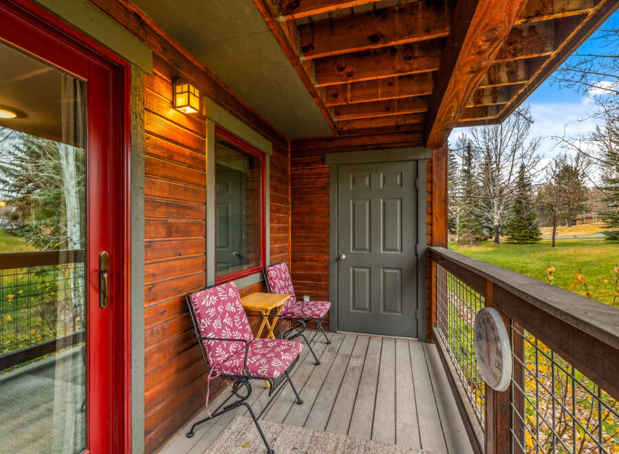 Enjoy the tranquility of this charming cabin's porch, perfect for morning coffee or evening relaxation.