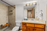 This inviting bathroom features a modern design with a touch of warmth.