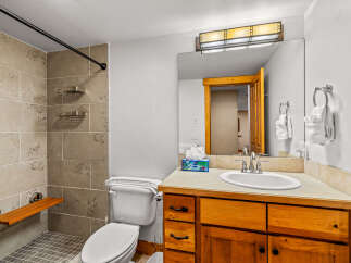 This inviting bathroom features a modern design with a touch of warmth.