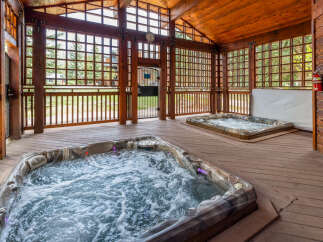 Relax and unwind in this luxurious spa retreat! Featuring two inviting hot tubs, this property offers the perfect setting for relaxation and rejuvenation.