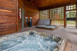 Relax and unwind in this luxurious hot tub oasis! This property features two hot tubs, perfect for enjoying a soothing soak.