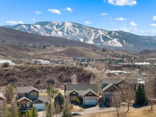 Nestled in a picturesque mountain setting, this property offers stunning views of the snow-capped peaks.
