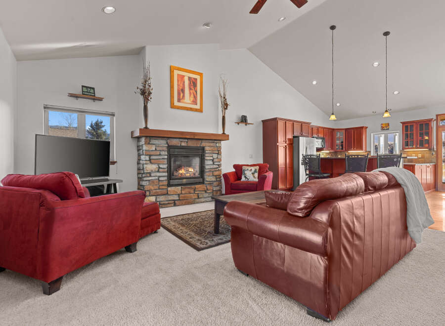 This stunning living room boasts a cozy fireplace, perfect for chilly evenings.