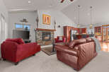 This stunning living room boasts a cozy fireplace, perfect for chilly evenings.