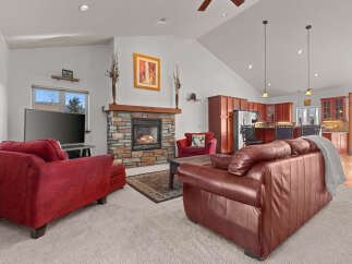 This stunning living room boasts a cozy fireplace, perfect for chilly evenings.