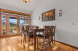 This stunning dining area boasts a warm and inviting atmosphere, perfect for enjoying meals with family and friends.