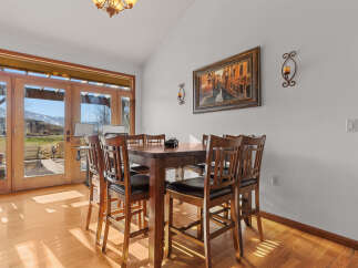 This stunning dining area boasts a warm and inviting atmosphere, perfect for enjoying meals with family and friends.