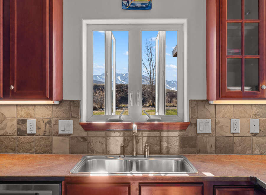 This stunning kitchen boasts a bright and airy atmosphere, perfect for culinary creations.