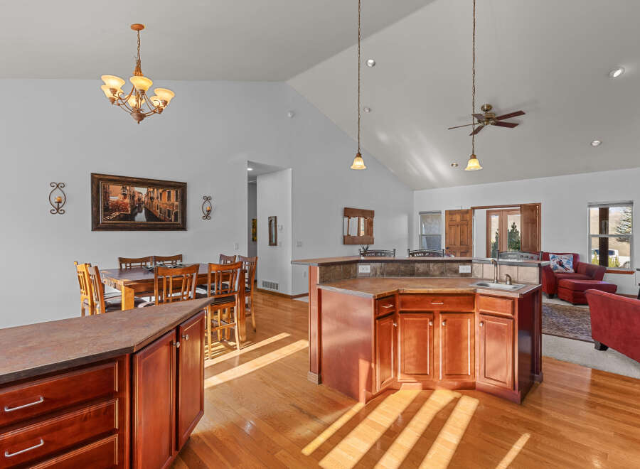 This stunning property boasts a spacious kitchen with a large island, perfect for entertaining.