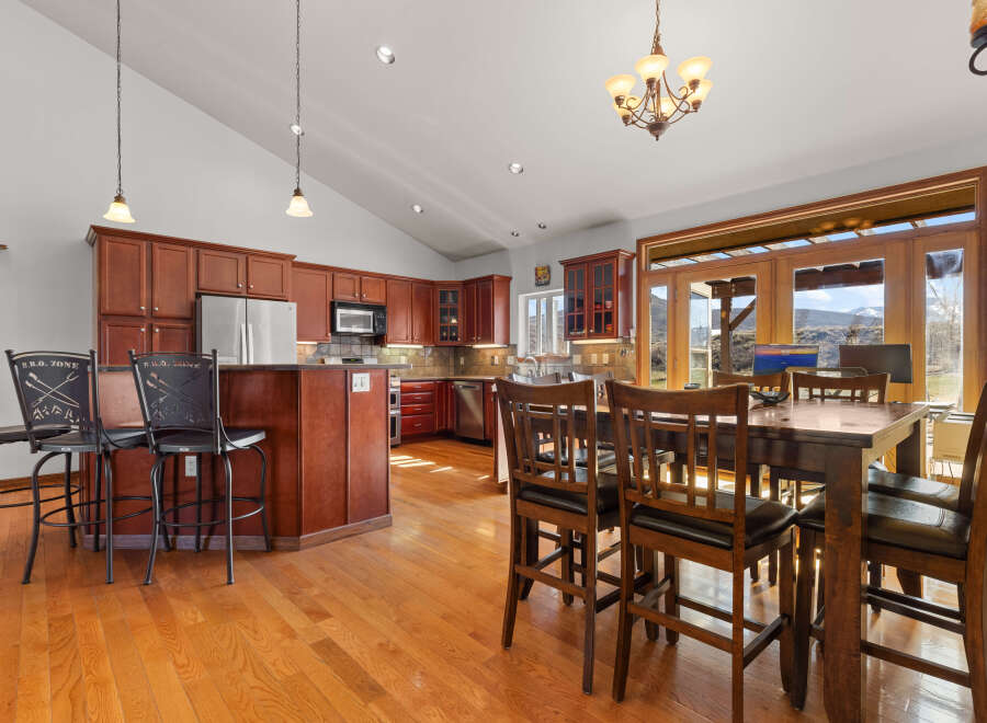 This stunning kitchen boasts rich, dark wood cabinetry and a spacious layout, perfect for both cooking and entertaining.