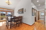 This stunning dining room boasts a warm and inviting atmosphere, perfect for hosting gatherings.