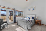 This inviting bedroom features a cozy bed with a stylish gray comforter and decorative pillows.