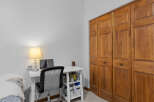 This cozy room features a functional workspace with a desk, chair, and a laptop, perfect for work or study.