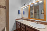 This beautiful bathroom features a double vanity with ample counter space, perfect for getting ready in the morning.