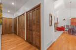 Step into this inviting home and discover a hallway with beautiful hardwood floors and ample storage space.