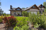 This stunning property boasts a beautiful exterior with a charming facade and a well-maintained lawn.