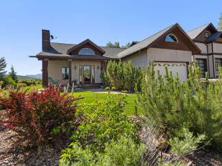 This stunning property boasts a beautiful exterior with a charming facade and a well-maintained lawn.