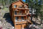This stunning multi-story home offers a luxurious living experience with its expansive balconies and inviting outdoor spaces.