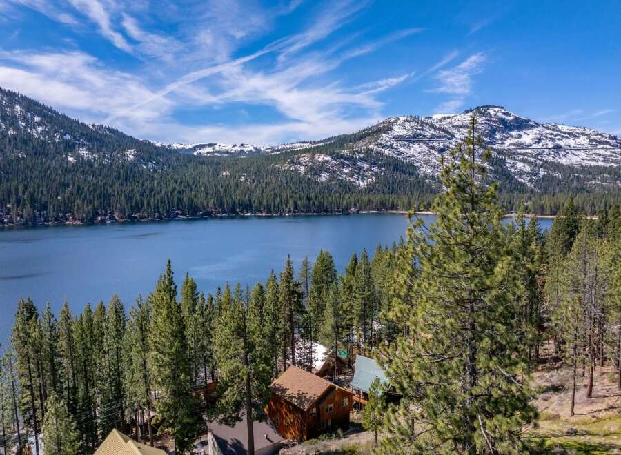 Discover your dream retreat nestled amidst the serene beauty of the mountains and a pristine lake.