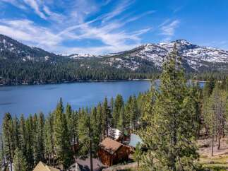 Discover your dream retreat nestled amidst the serene beauty of the mountains and a pristine lake.