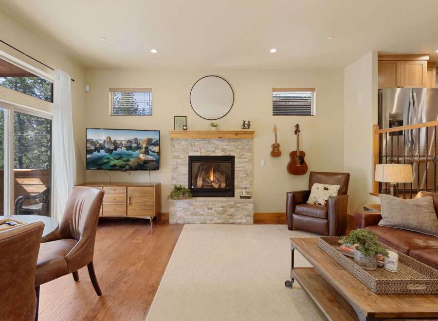 Step into luxury with this stunning property featuring a cozy fireplace, perfect for those chilly evenings.
