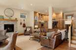 This stunning property boasts a cozy living room with a fireplace, perfect for relaxing evenings.