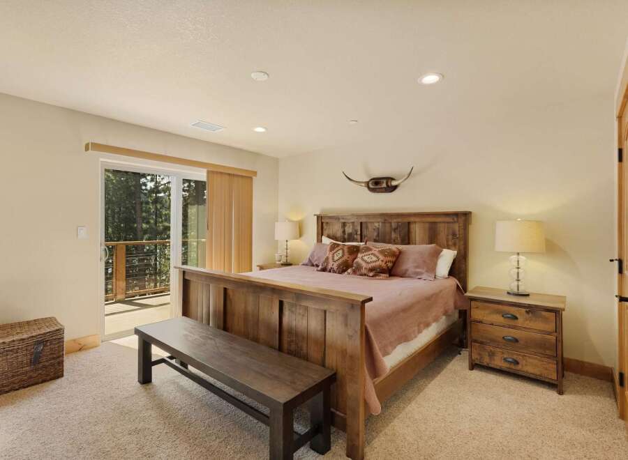 This stunning bedroom boasts a rustic charm with its wooden furniture and warm color palette.
