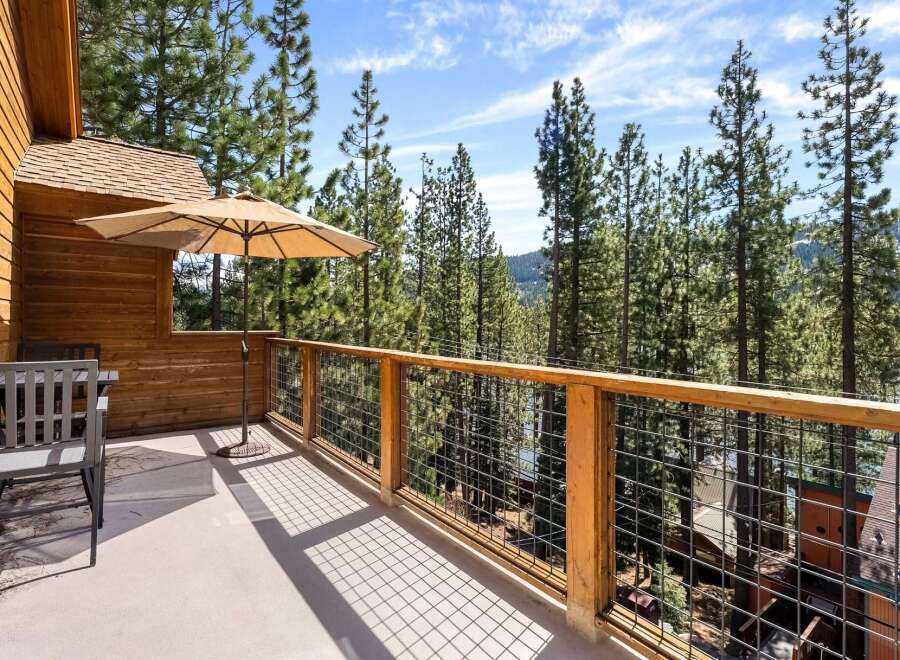 Enjoy breathtaking views from this stunning property, featuring a spacious deck perfect for relaxation.