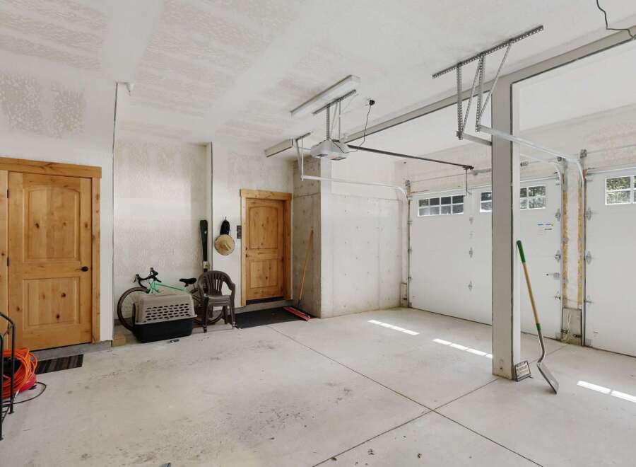 Discover the potential of this spacious garage, perfect for storage or a workshop.