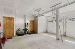 Discover the potential of this spacious garage, perfect for storage or a workshop.
