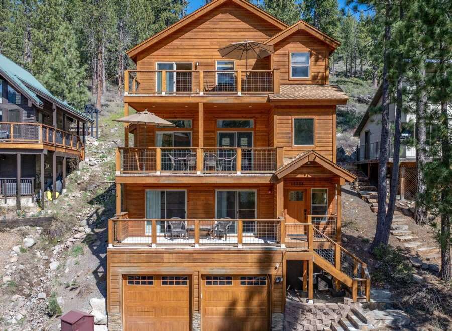 This stunning wooden cabin offers a serene retreat with multiple levels of balconies, perfect for enjoying the surrounding natural beauty.
