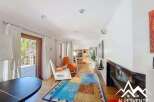 Discover the charm of this stunning property, featuring a bright and airy living space with a modern fireplace.