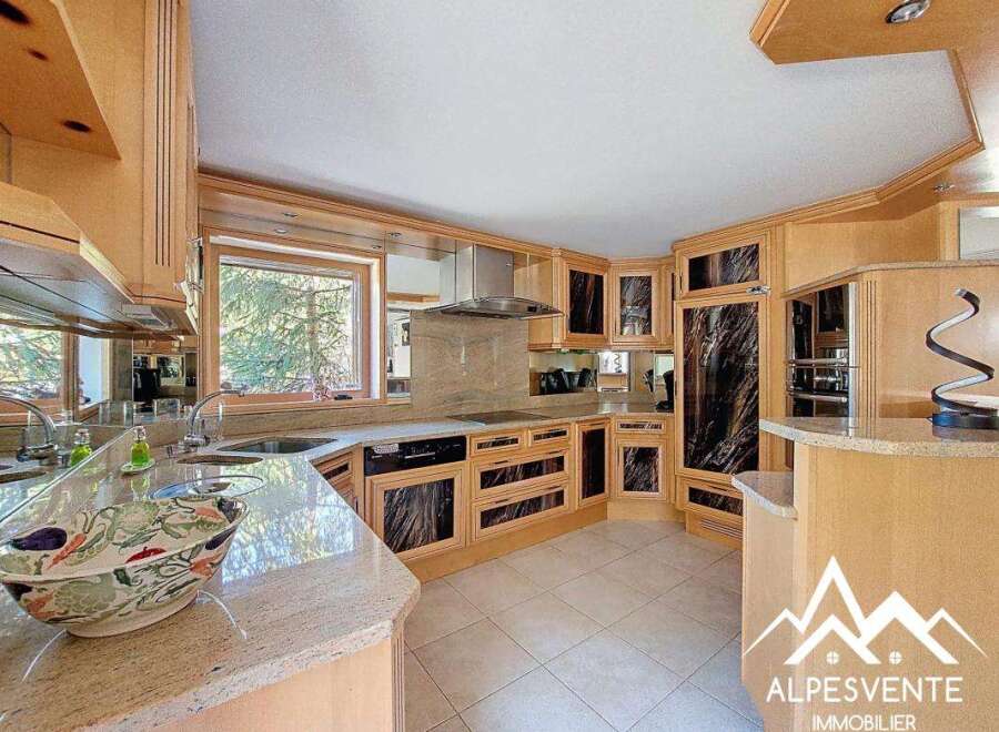 Discover the epitome of culinary elegance in this stunning kitchen.