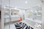 Discover luxury in this stunning bathroom! Featuring a sleek, modern design with a spacious layout, this bathroom offers a spa-like experience.