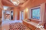 Discover the charm of this stunning property, featuring a warm and inviting interior with wooden paneling throughout.