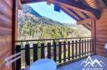 Enjoy breathtaking mountain views from this charming balcony.