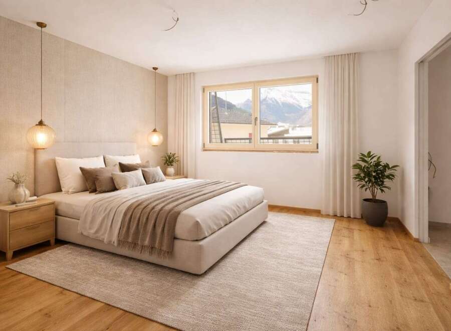 This stunning bedroom offers a serene retreat with its neutral color palette and natural light.
