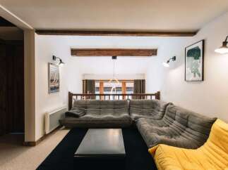 This cozy living space features a stylish sectional sofa, perfect for relaxing and entertaining.