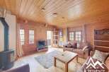 Discover the charm of this cozy cabin, featuring a warm wooden interior and a welcoming atmosphere.