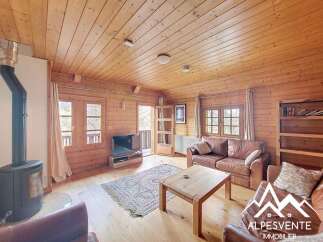 Discover the charm of this cozy cabin, featuring a warm wooden interior and a welcoming atmosphere.