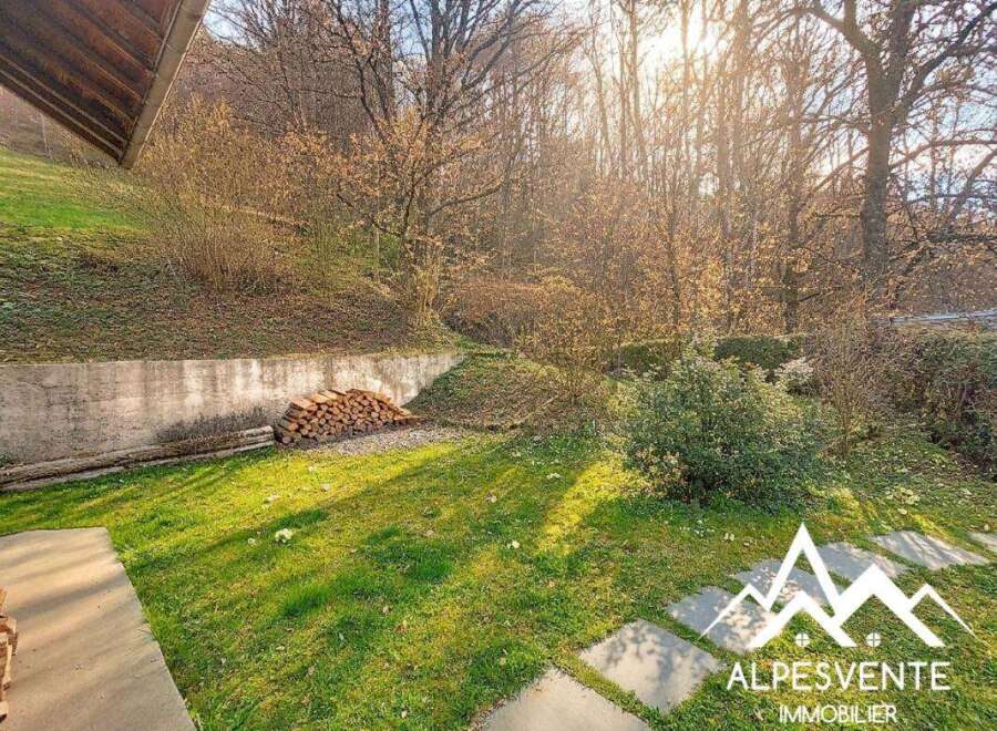 Discover the charm of this property, featuring a lush green lawn and a serene outdoor space.