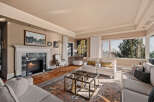 Step into luxury with this stunning living room, featuring a cozy fireplace and elegant design.